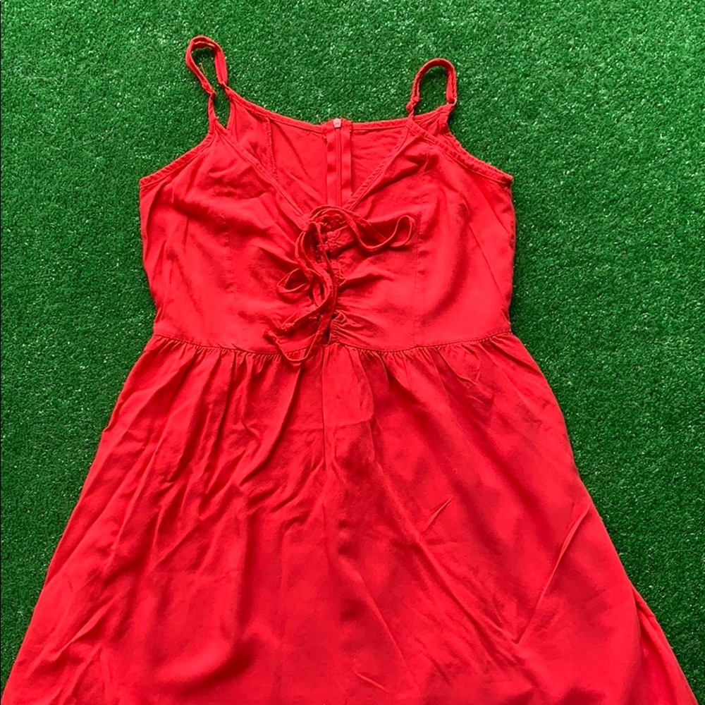 A red dress with straps.